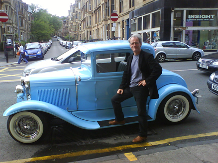 ian with car small